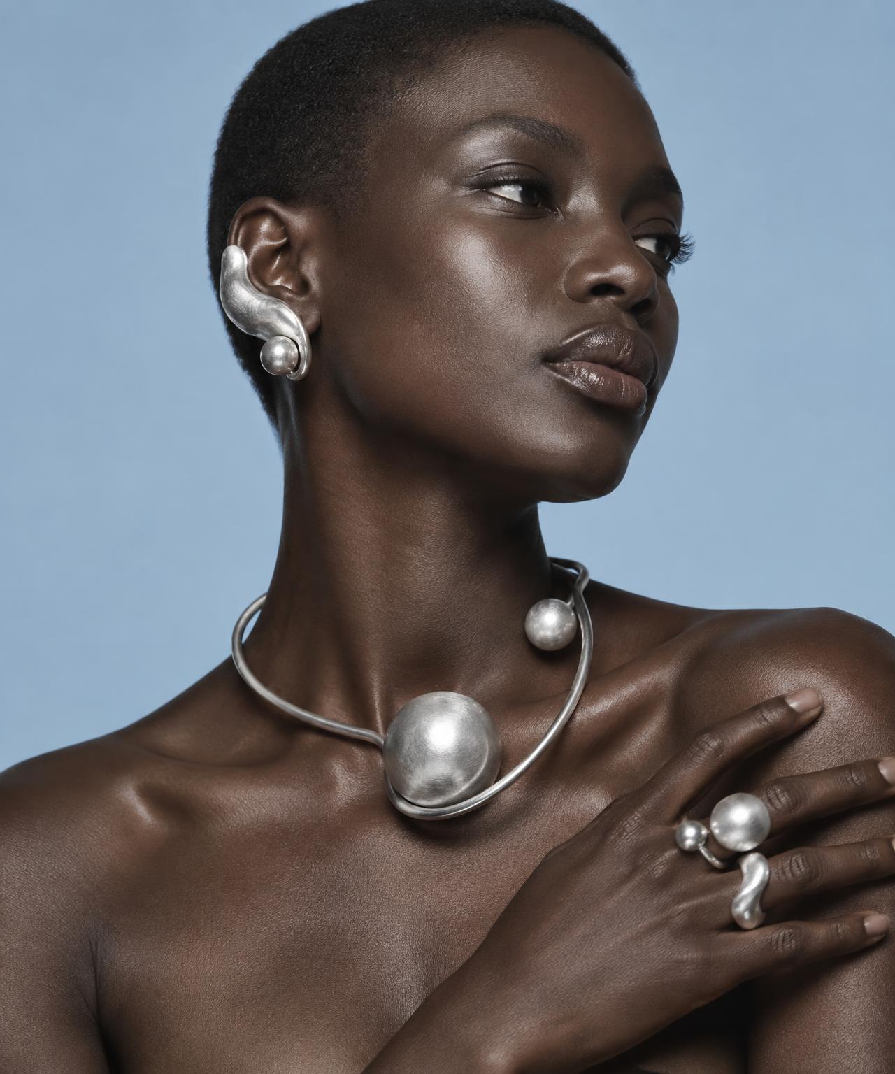 Orbital silver necklace and ear piece